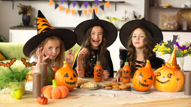 Three girls dressed as witches for Halloween