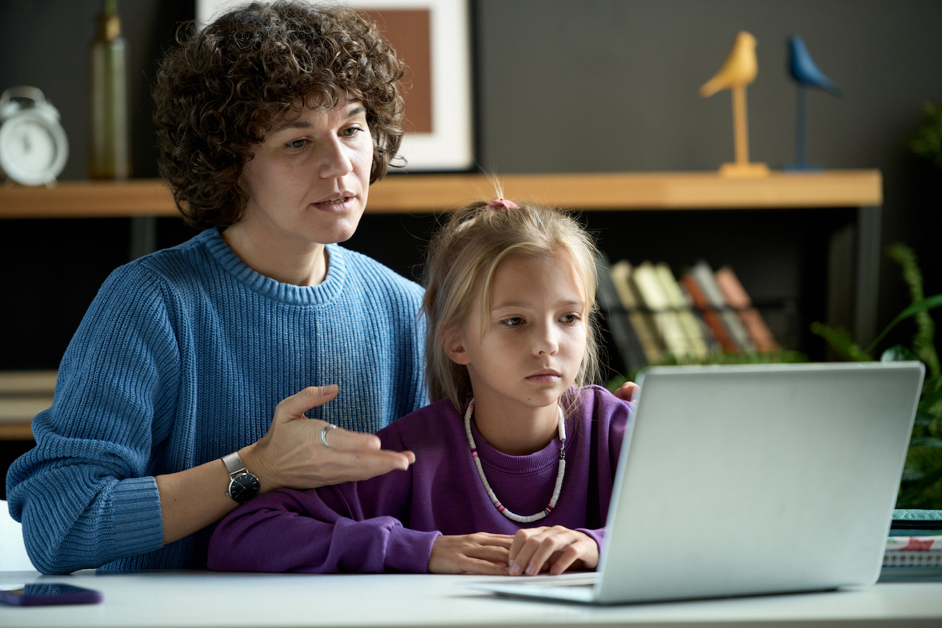 Mom and daughter looking at computer