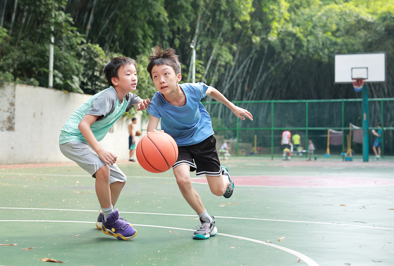 Boys playing basketball