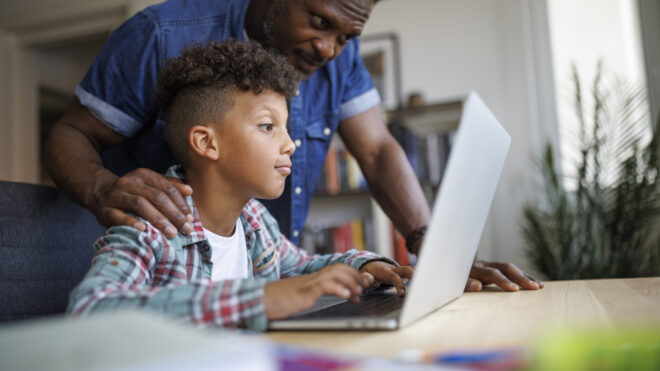 father and son studying