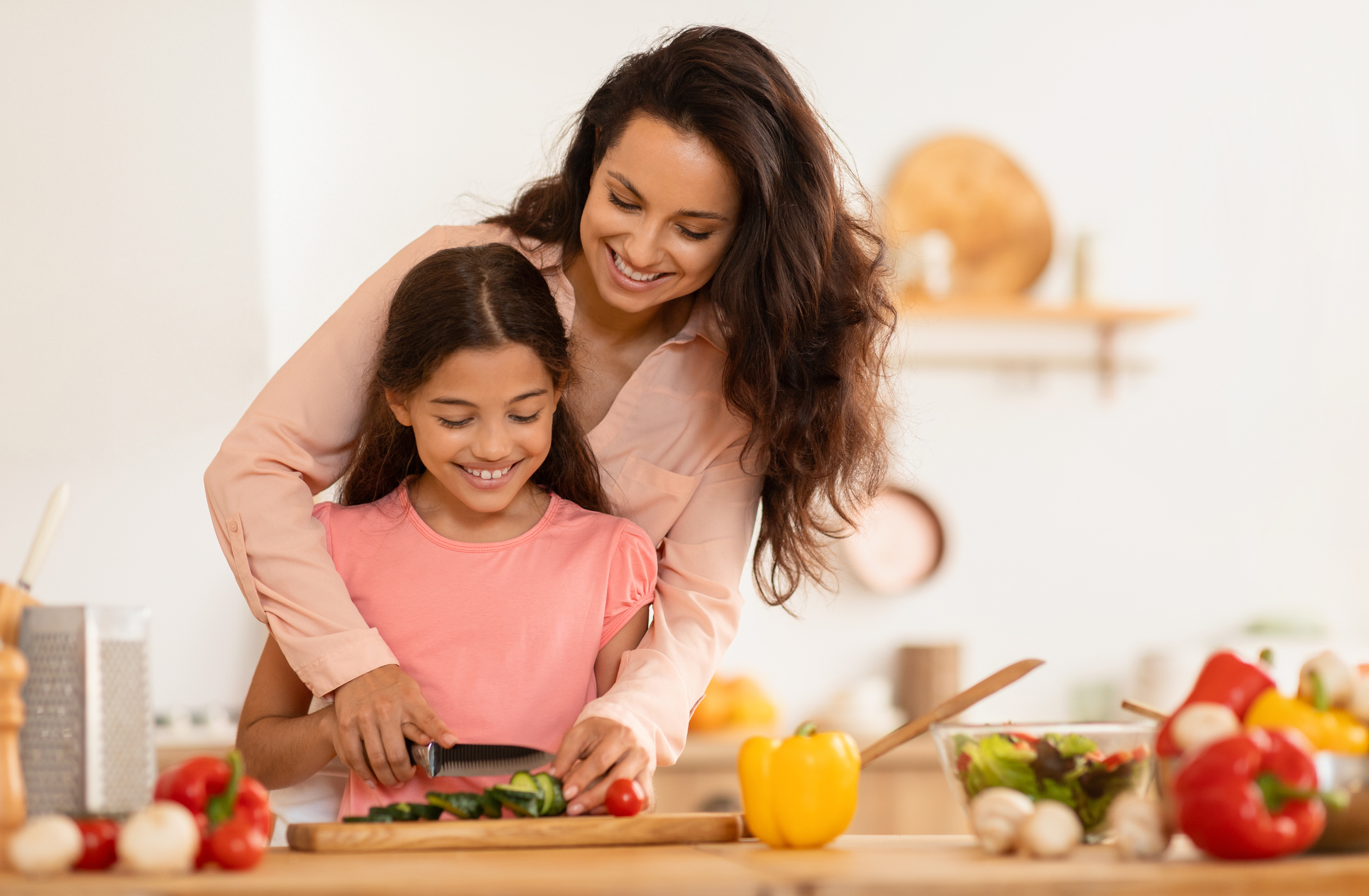 Happy Arab Mom And Daughter Cooking Salad In Modern Kitchen
